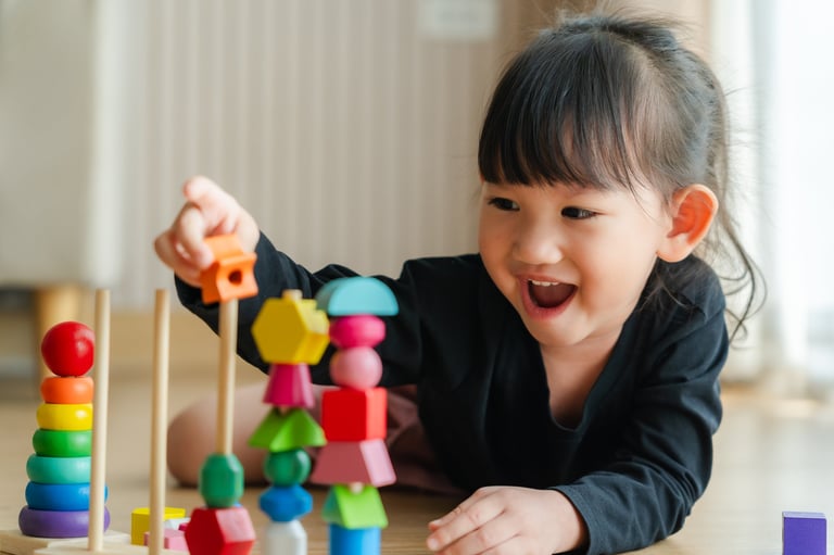 Child playing with wooden blocks
